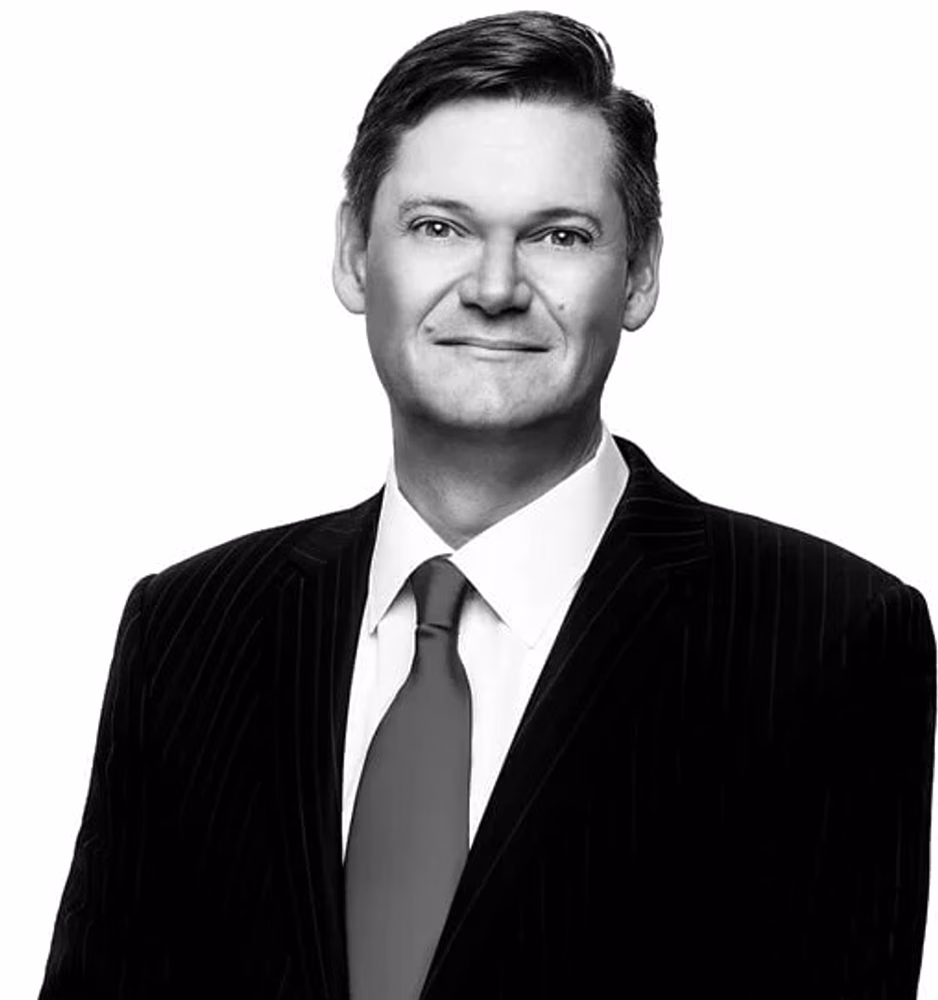 Black and white portrait of Mark J. Haushalter, Of Counsel, in a pinstriped suit.
