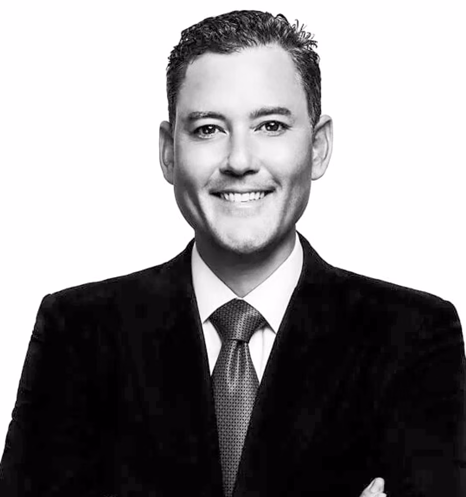 Black and white portrait of Ryan T. Okabe, Of Counsel, in a dark suit.